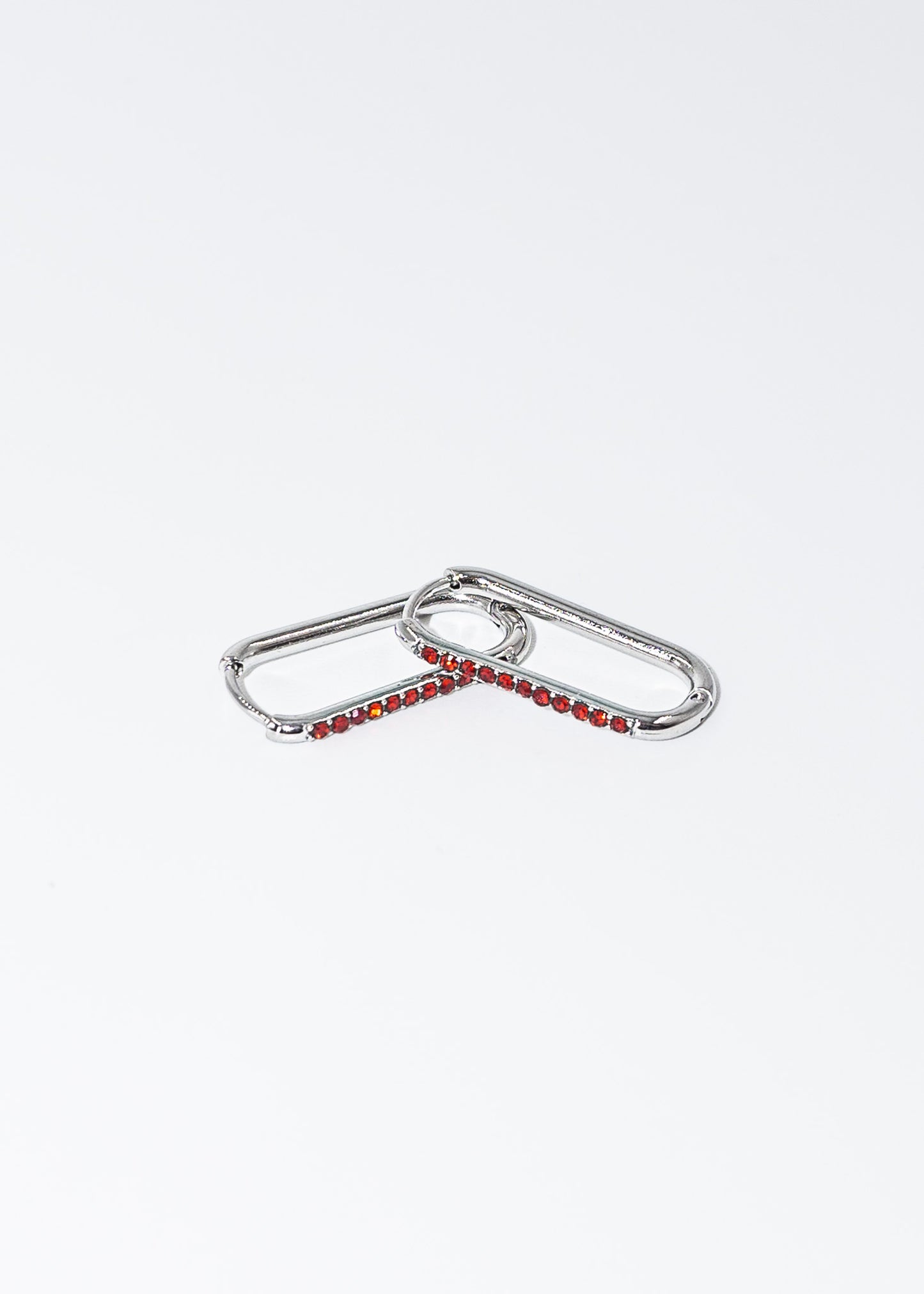 Caravanas aros bisagra zirconias rojas acero quirúrgico