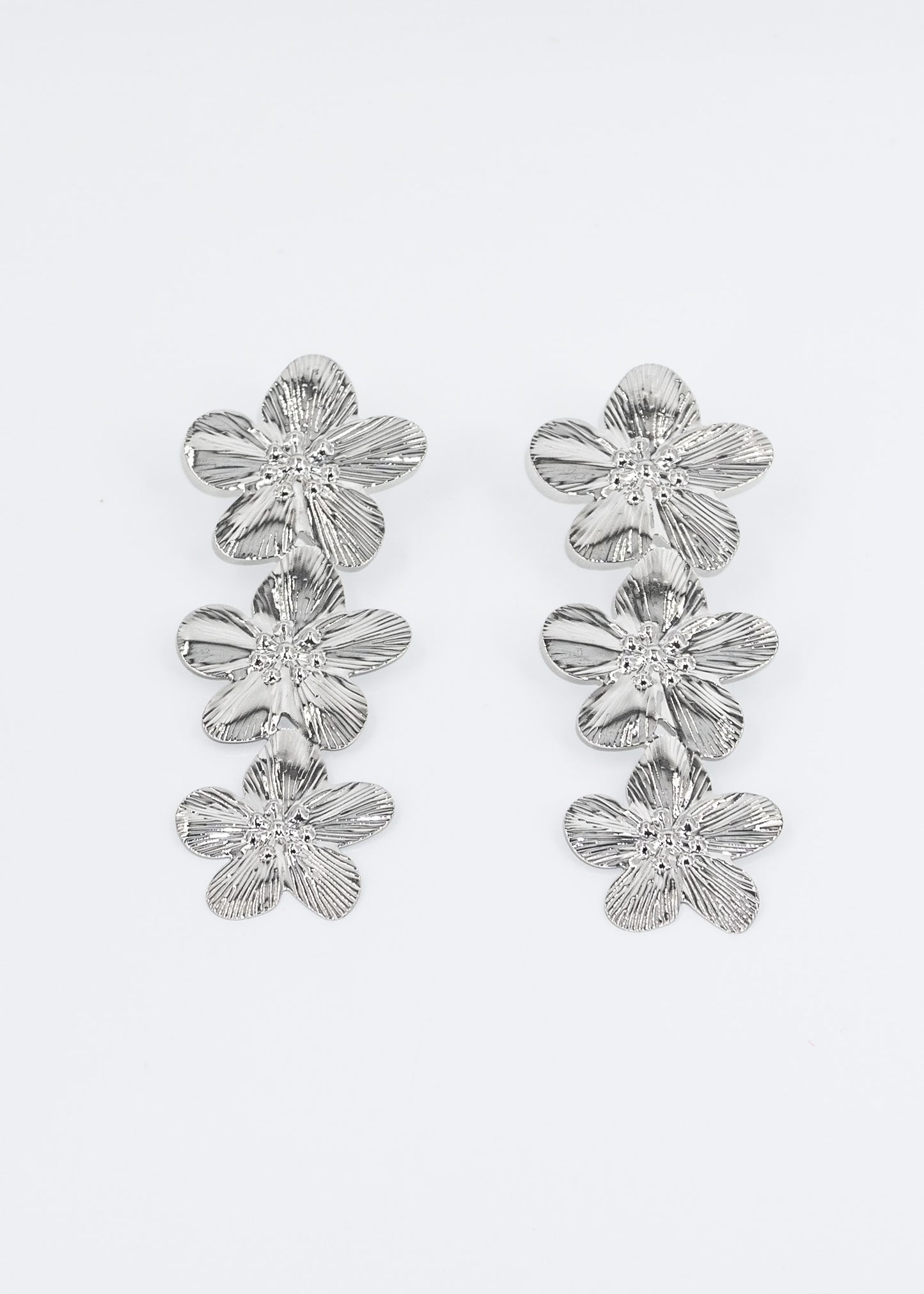 Caravanas largas flores metálicas