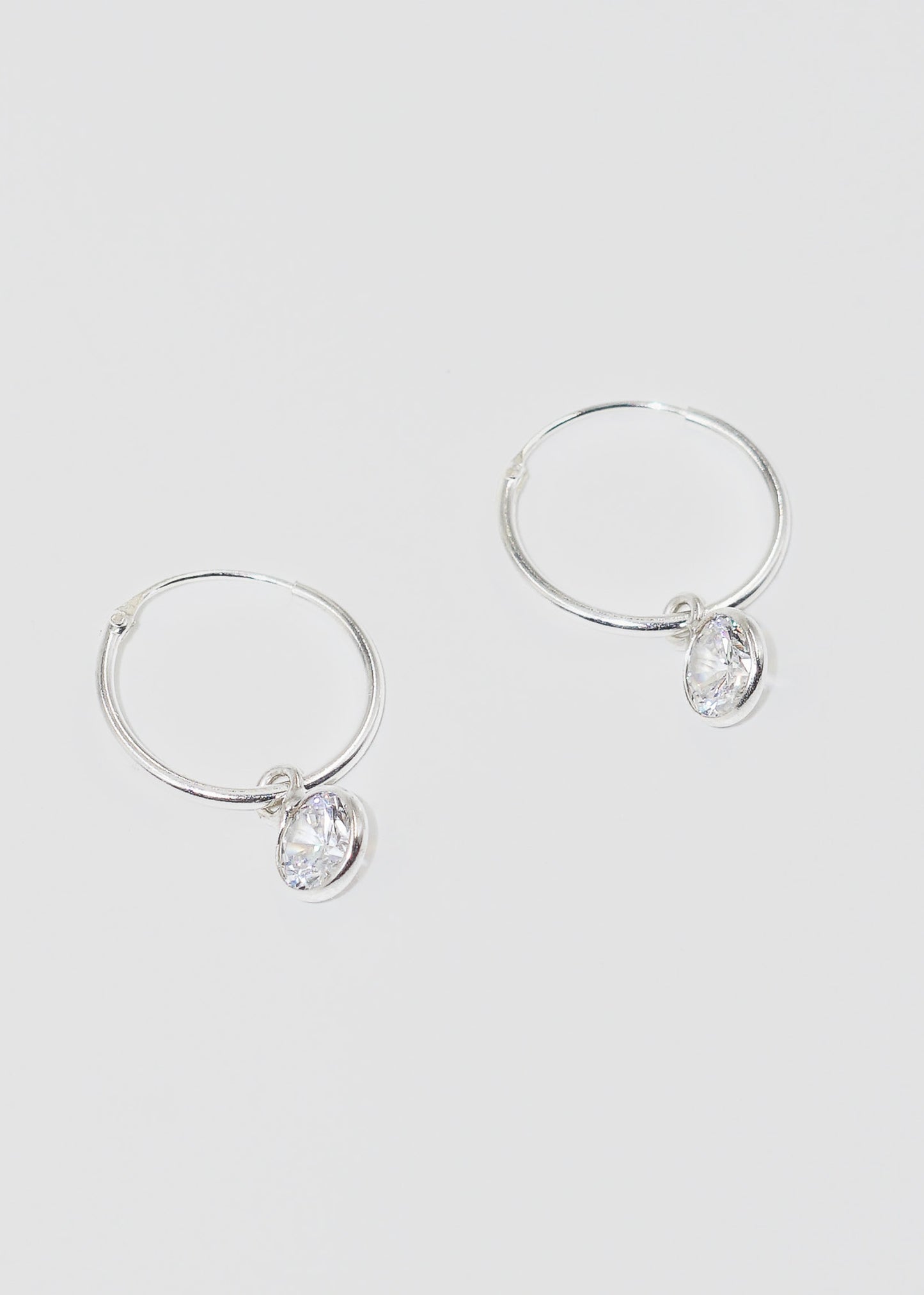 Caravanas aros con dije punto luz zirconia plata 925