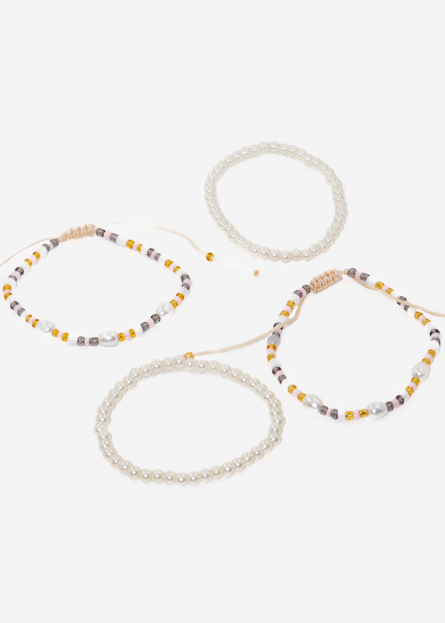 Pulseras ajustables set x4 perlas y mostacillas