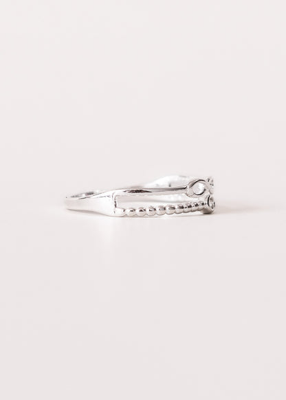 Anillo infinito y punto luz enchapado en plata