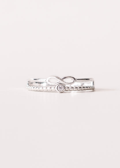 Anillo infinito y punto luz enchapado en plata