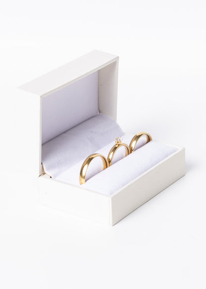 Set alianzas acero quirúrgico 4mm con cintillo y estuche - Doradas