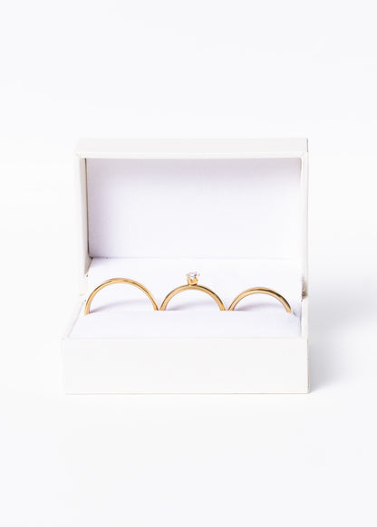 Set alianzas acero quirúrgico 4mm con cintillo y estuche - Doradas