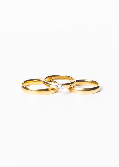 Set alianzas acero quirúrgico 4mm con cintillo y estuche - Doradas