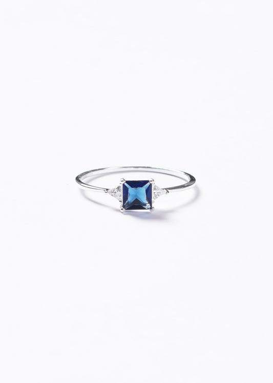 Anillo zirconia azul 4 puntas y laterales plata 925