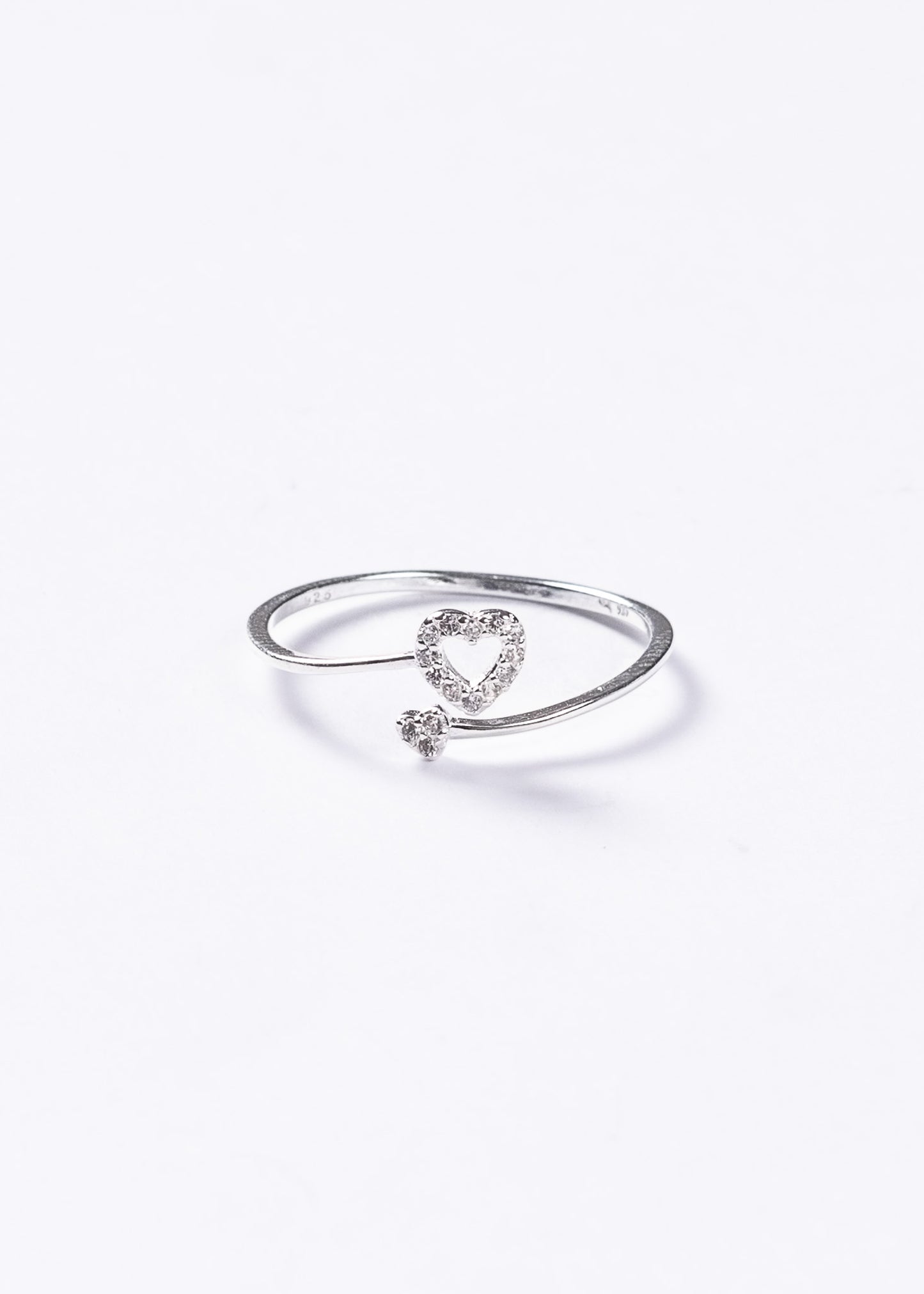 Anillo ajustable doble corazón zirconias plata 925