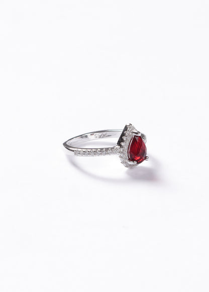 Anillo gota roja zirconias laterales plata 925