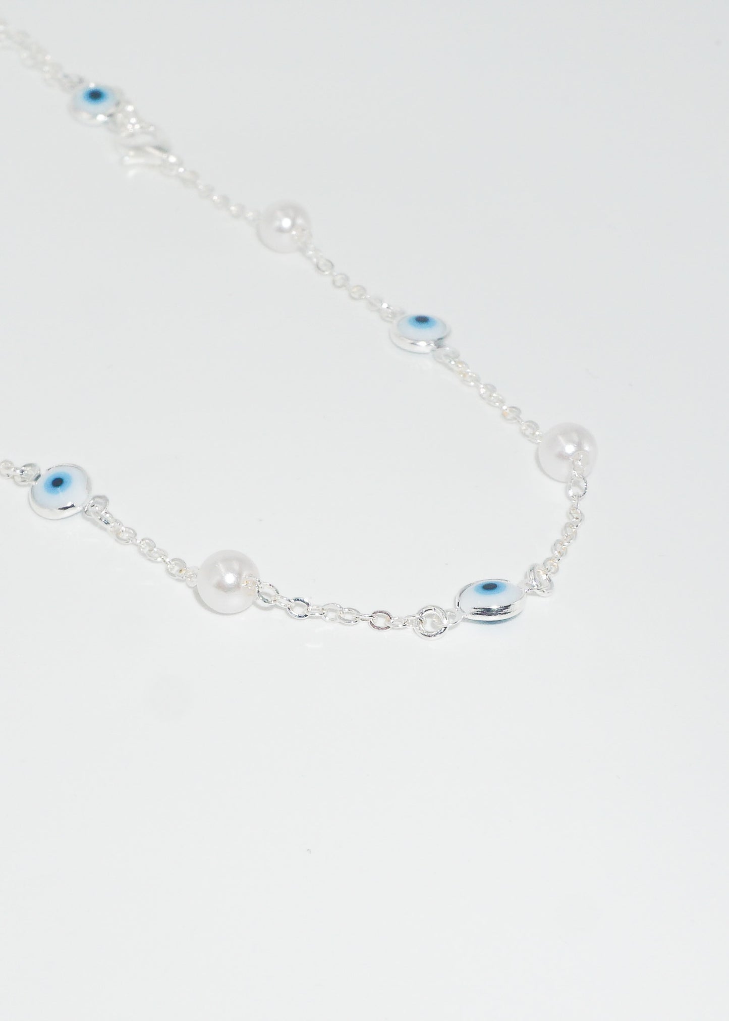 Collar cadena perlas y ojos turcos