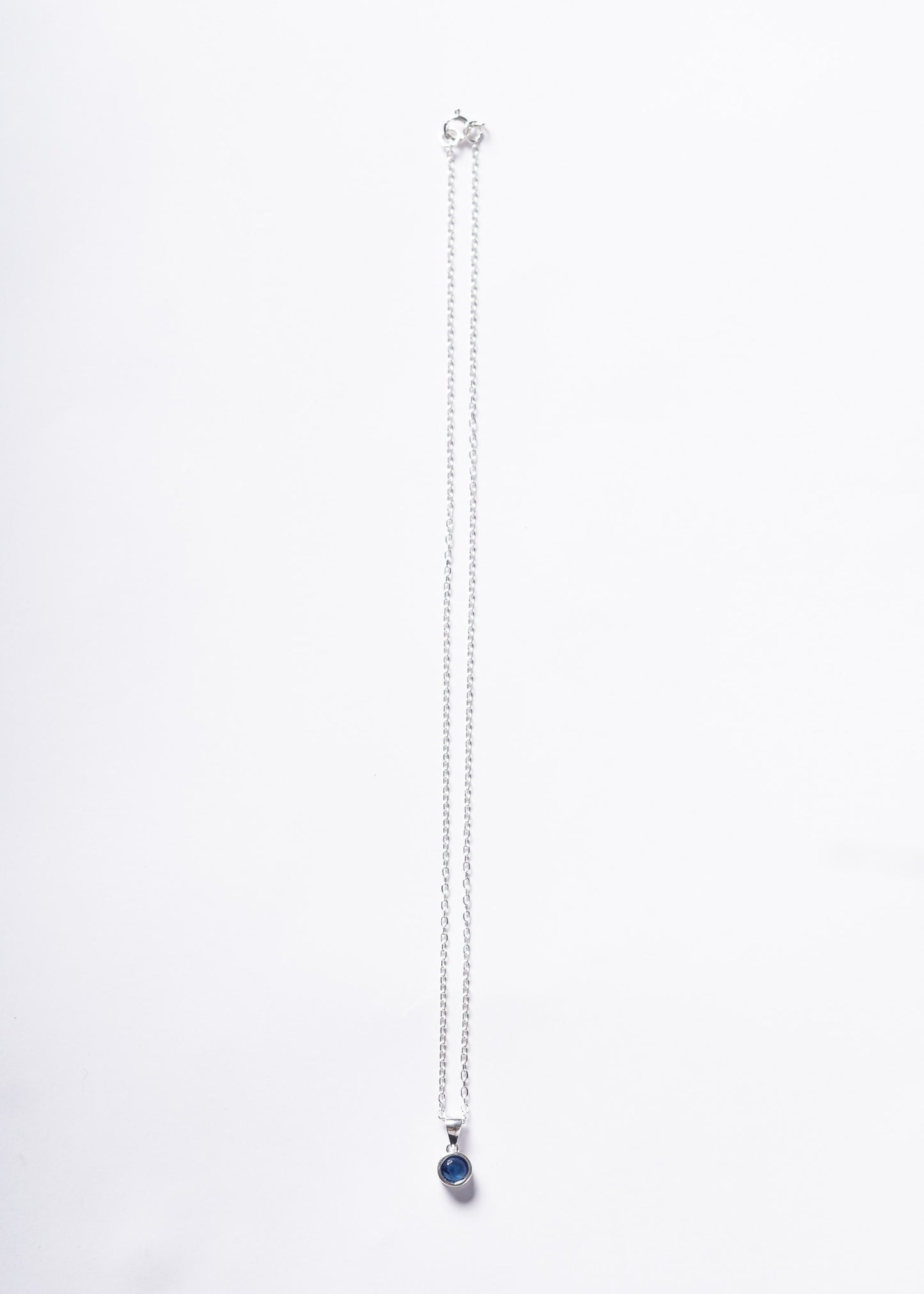 Cadena collar forcé con dije punto luz azul plata 925