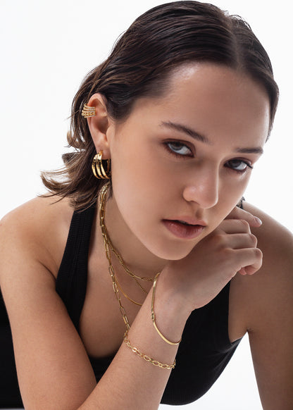 Pulsera chata con corazón baño en oro 18k