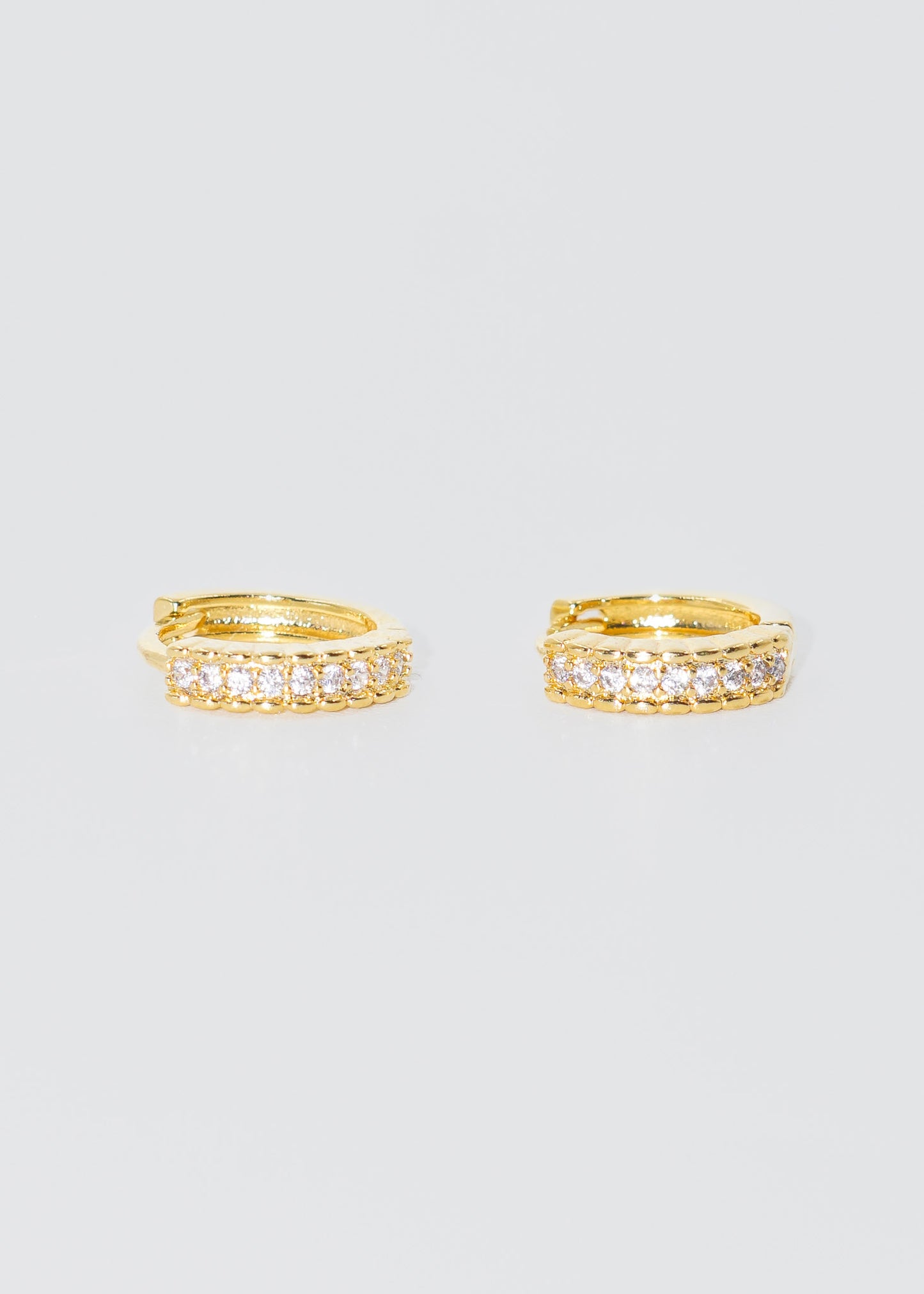 Caravanas aros con zirconia baño en oro 18k