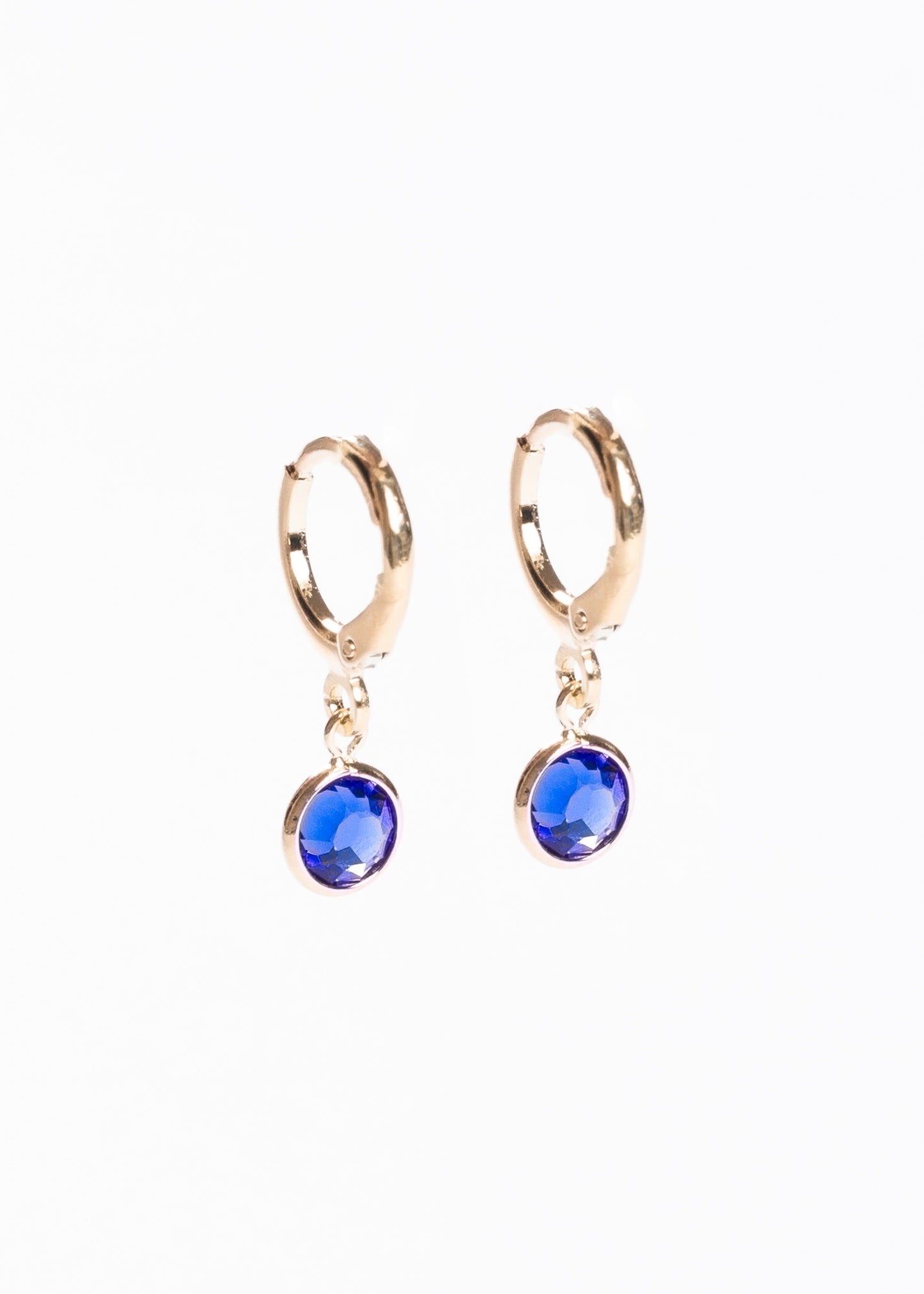 Caravanas aros con dije punto luz azul baño en oro 18k