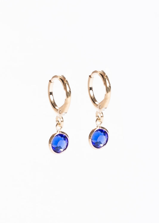 Caravanas aros con dije punto luz azul baño en oro 18k