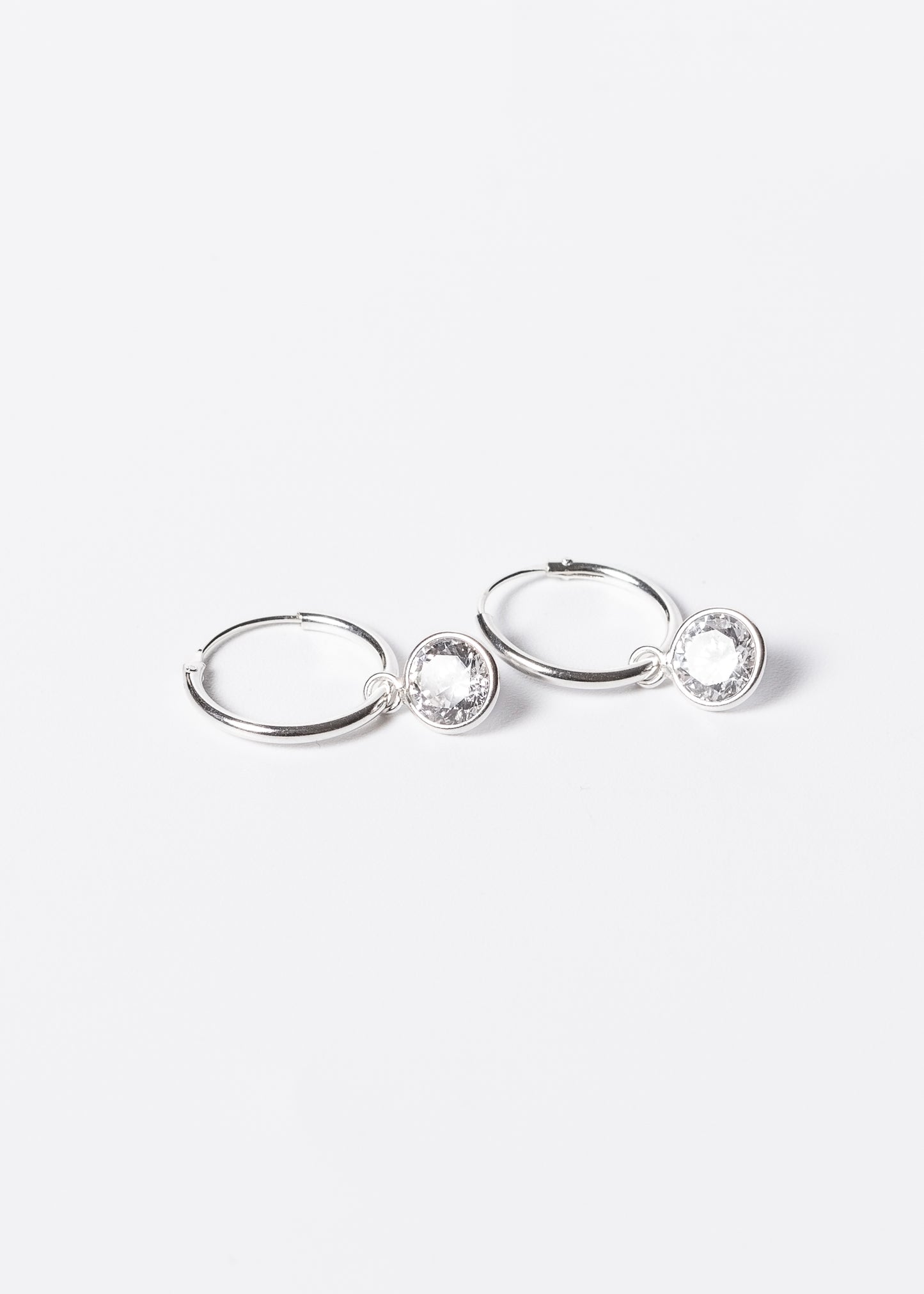 Caravanas aros con dije punto luz zirconia plata 925