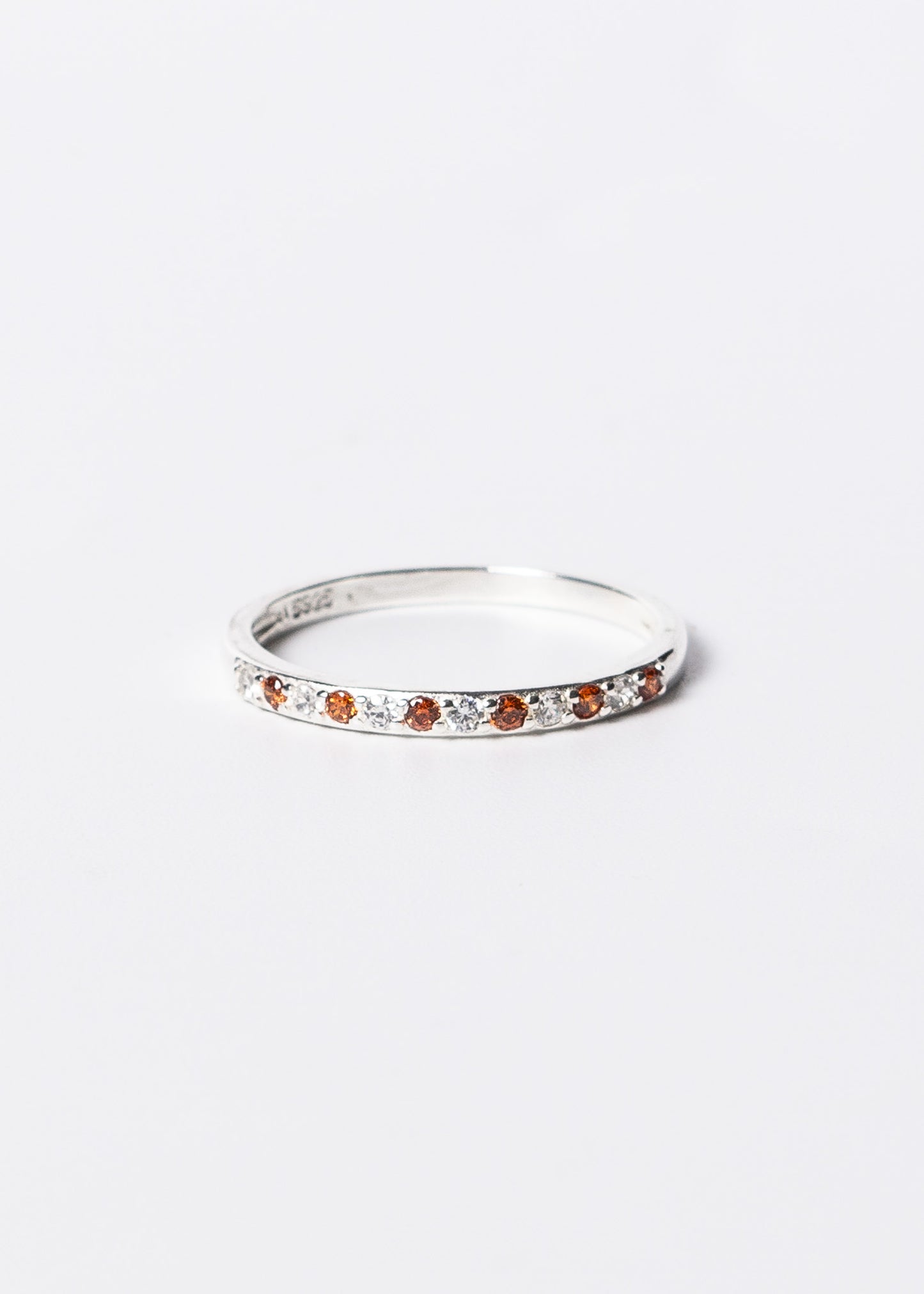 Anillo sin fin zirconias blancas y naranjas plata 925