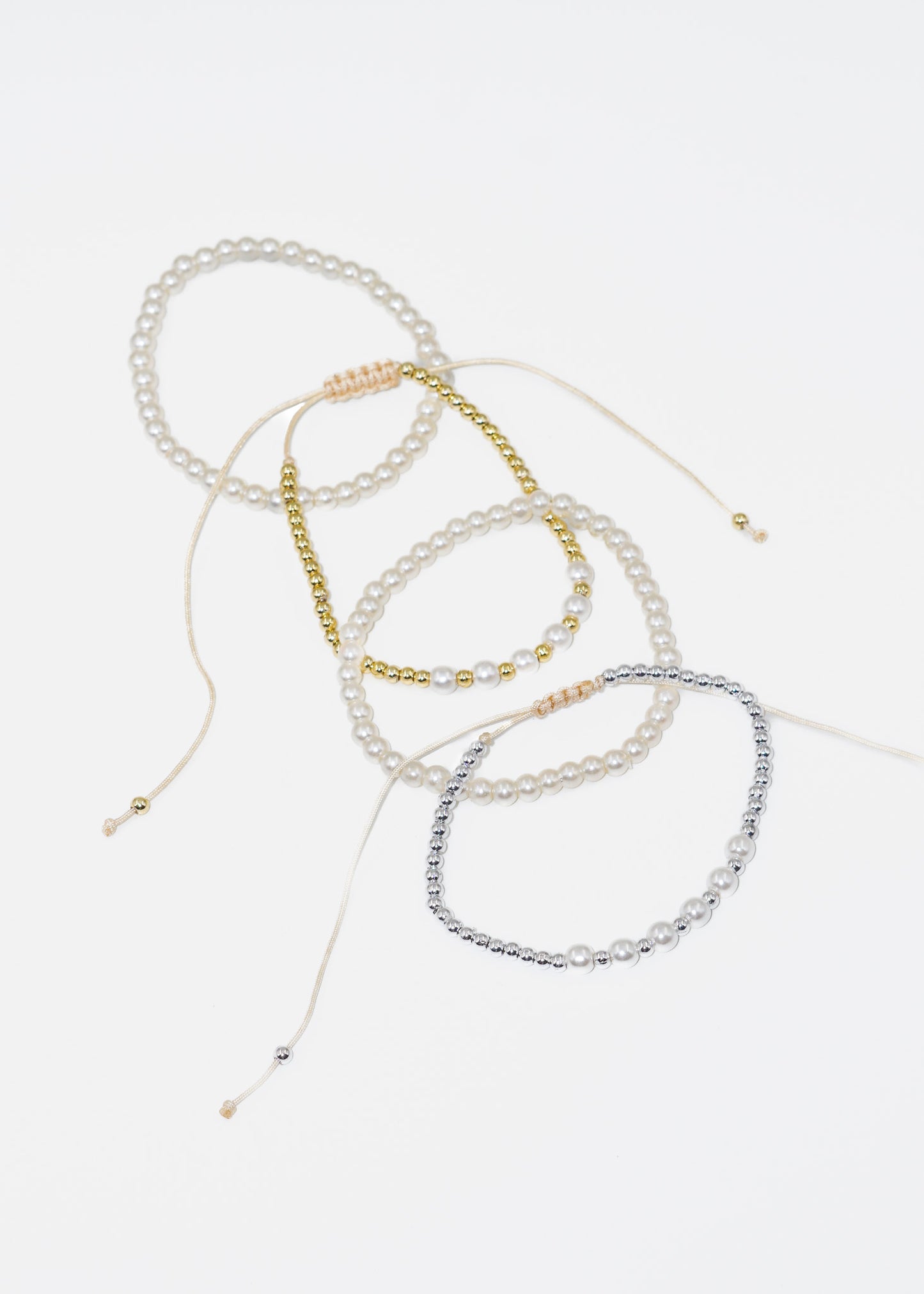 Pulseras ajustables set x4 perlas y esferas