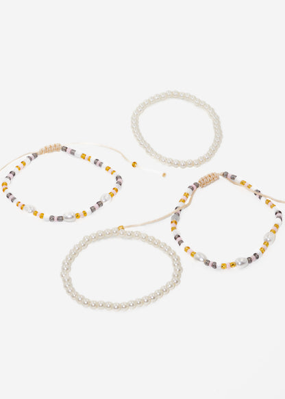 Pulseras ajustables set x4 perlas y mostacillas