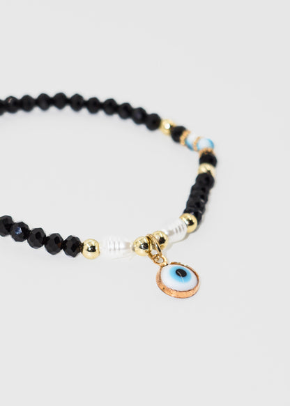 Pulsera mostacillas con dije ojo turco colgante elastizada