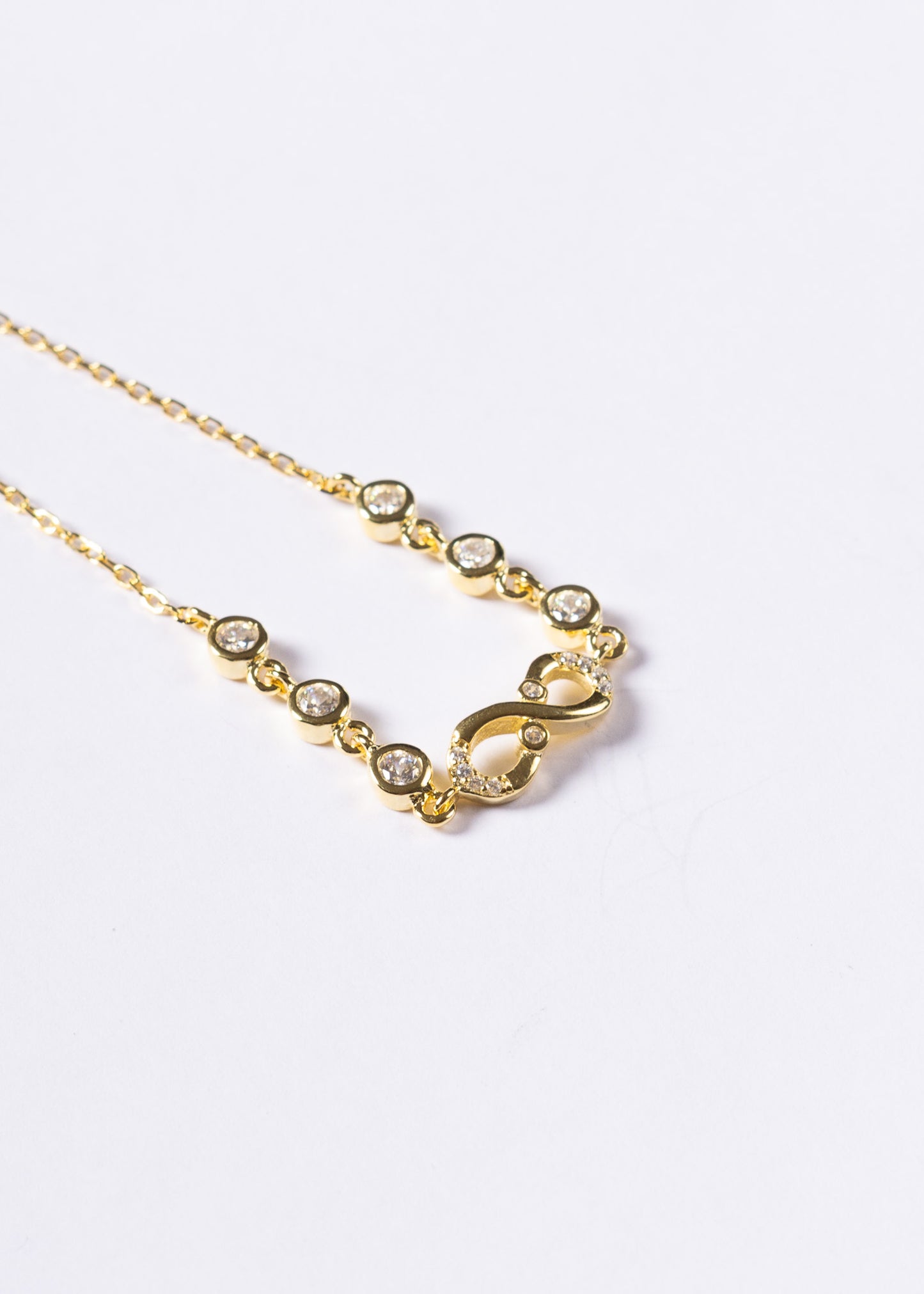 Pulsera infinito mitad zirconias y puntos luz Plata 925 & Baño en oro 18k